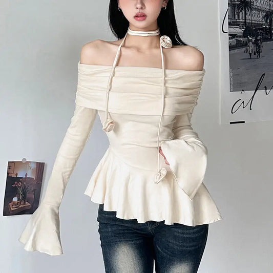 Off-the-shoulder long-sleeve top.