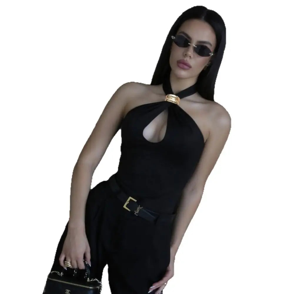 Woman in black halter top and pants.