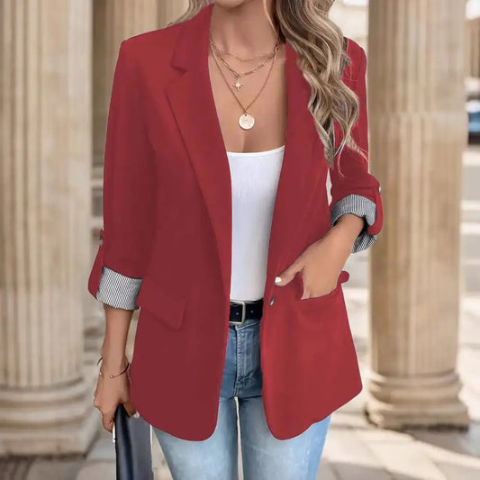 Red blazer with rolled-up sleeves.