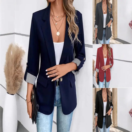 Women’s open-front blazer with rolled-up sleeves.