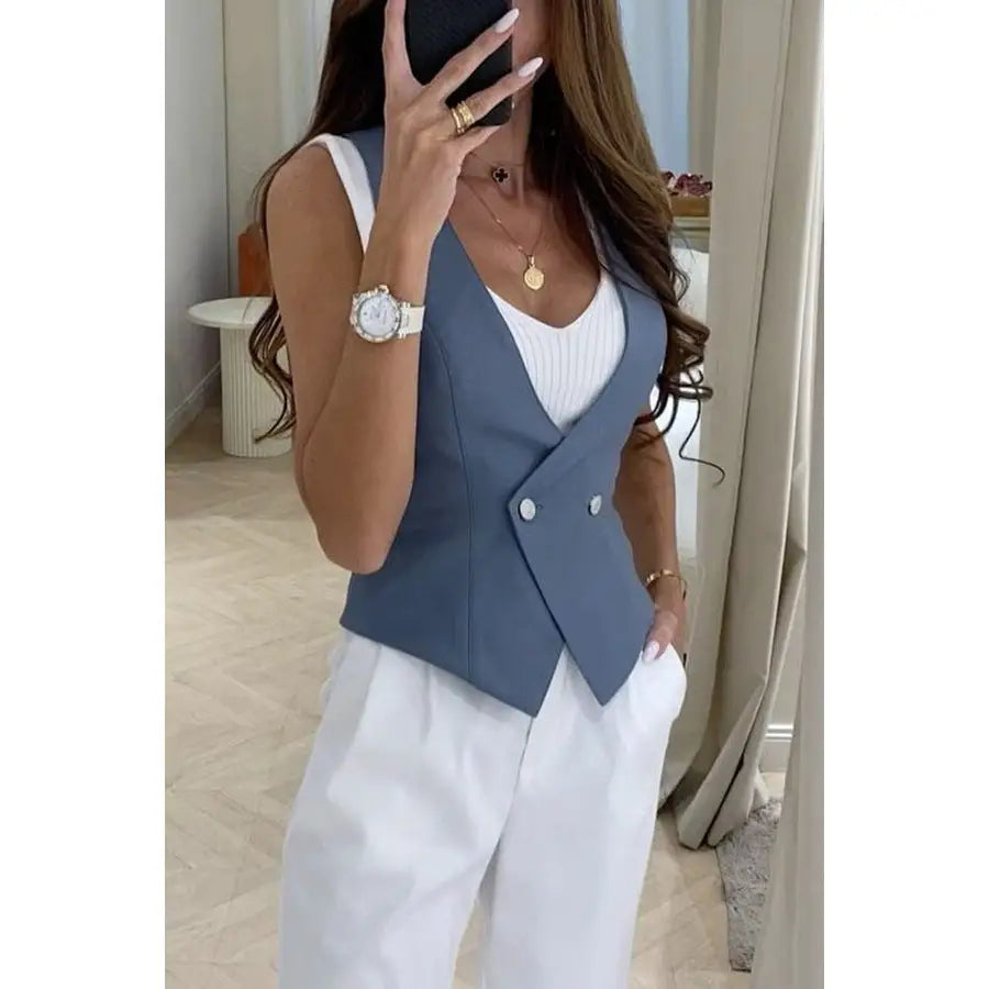Woman’s blue double-breasted vest.