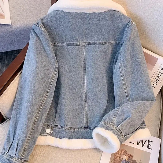 Denim jacket with white faux fur trim.