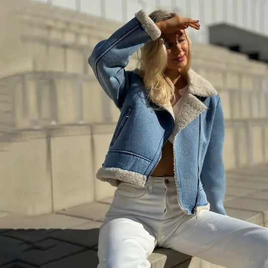 Light blue denim jacket with white faux fur trim.