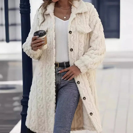 Cream-colored, button-down, textured coat.