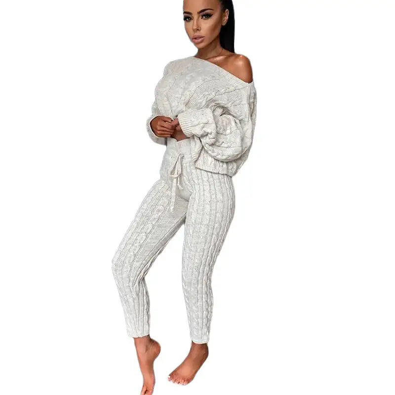 Woman in a cable-knit sweater and pants set.