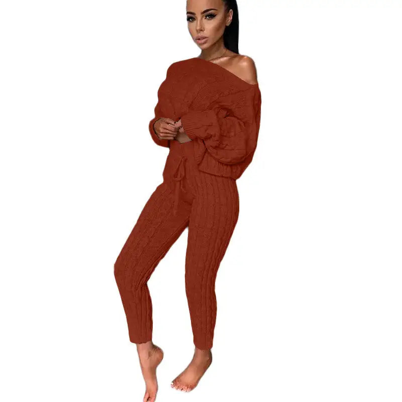 Woman in a brown knit pantsuit.