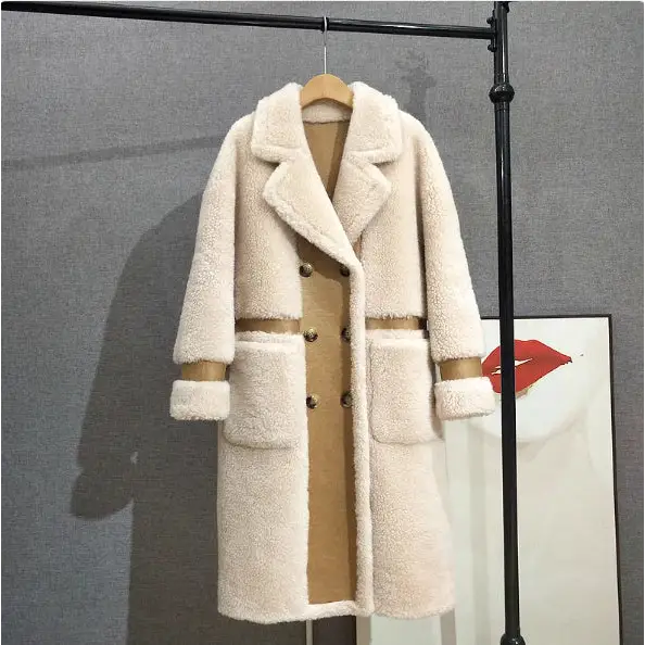 Cream-colored, double-breasted, faux fur coat.