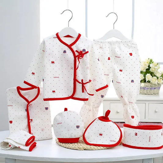 Baby clothing set with red trim.