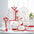 Baby clothing set with red trim.