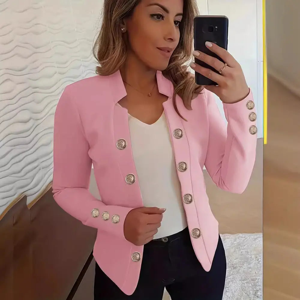 Pink blazer with decorative buttons.