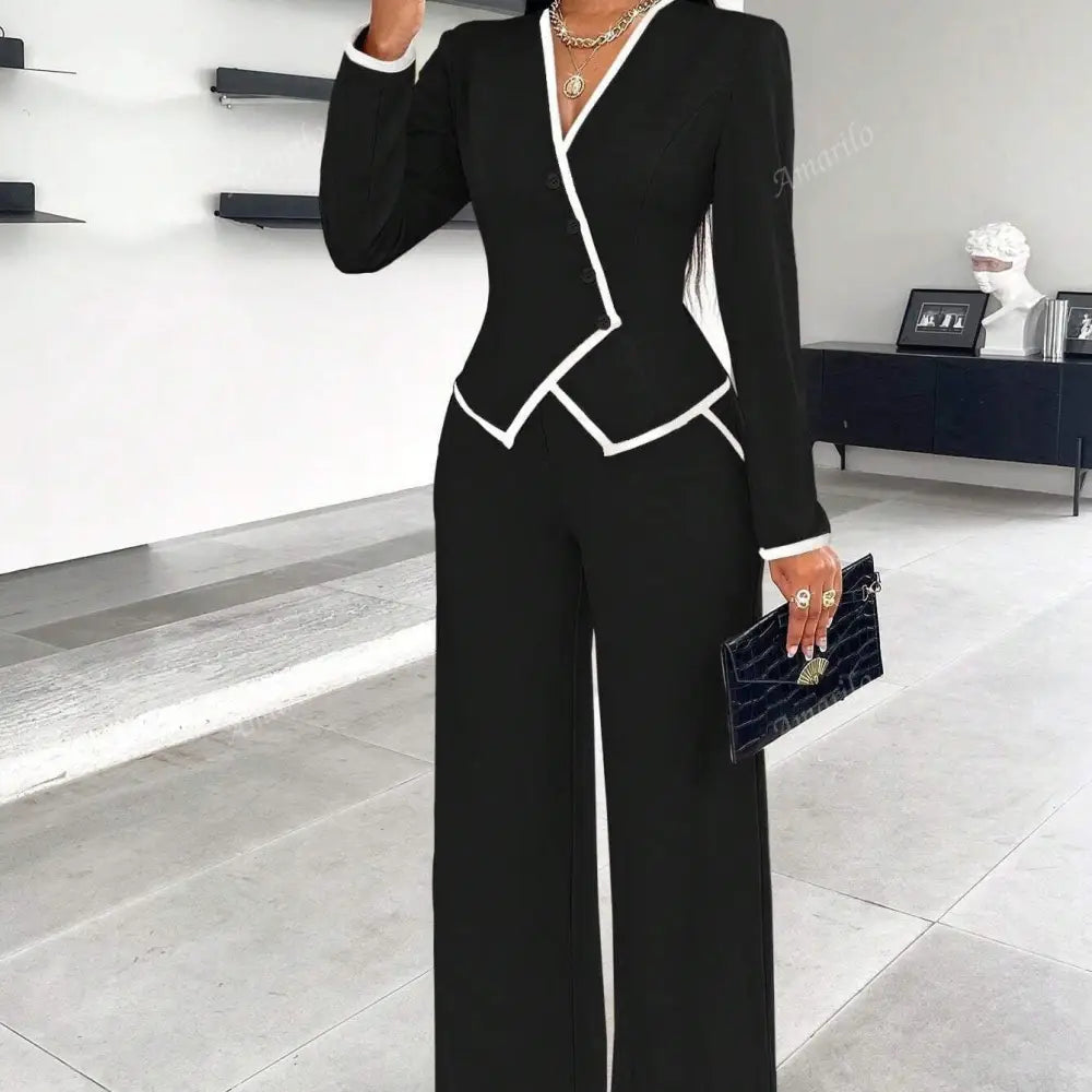 Black and white trimmed pant suit.