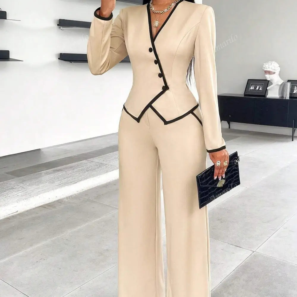 Beige pantsuit with black trim.
