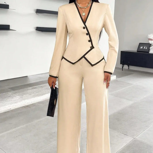 Beige pantsuit with black trim.