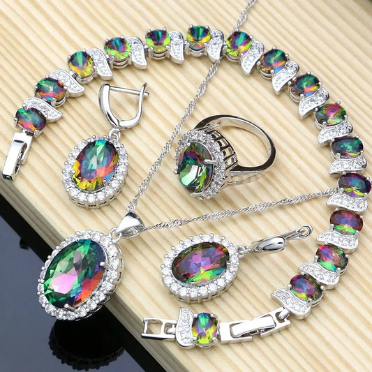 Silver jewelry set with iridescent gemstones.
