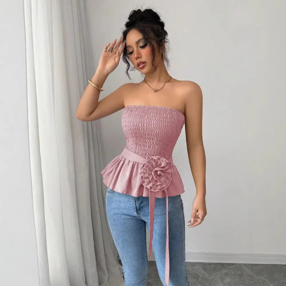 Pink strapless peplum top.