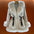 White fur-trimmed belted coat.