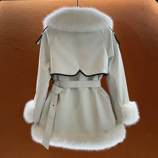 White belted coat with fur trim.