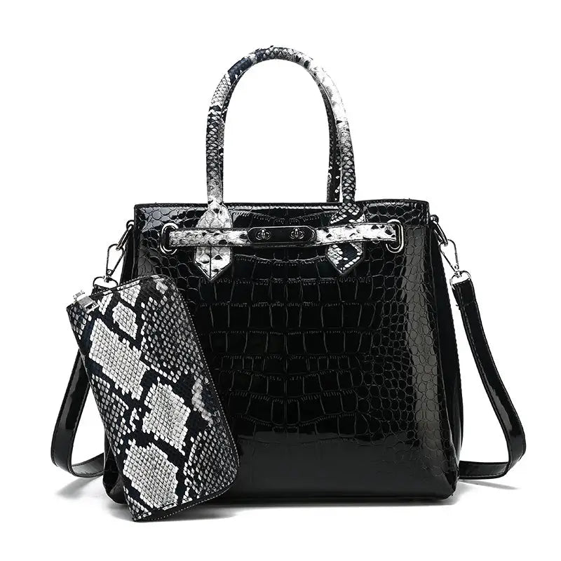 Black and snakeskin-accented handbag.