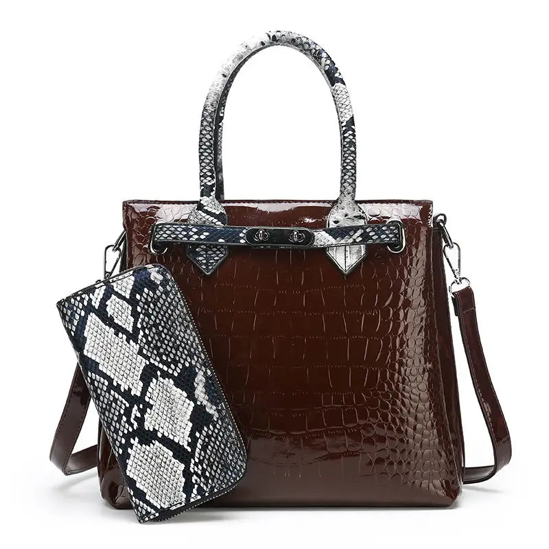 Brown faux-crocodile handbag with snakeskin accents.