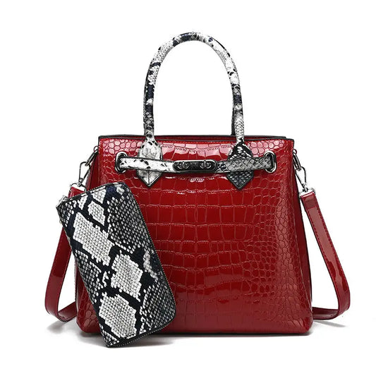 Red crocodile-patterned handbag with snakeskin accents.