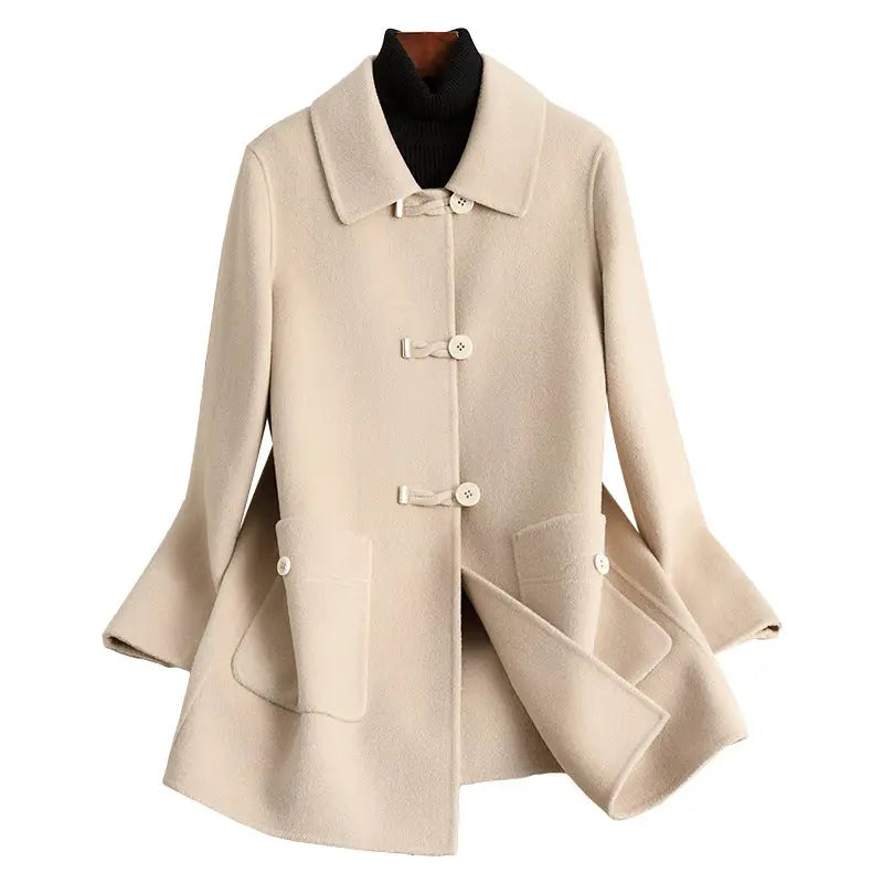 Beige wool coat with toggle closures.