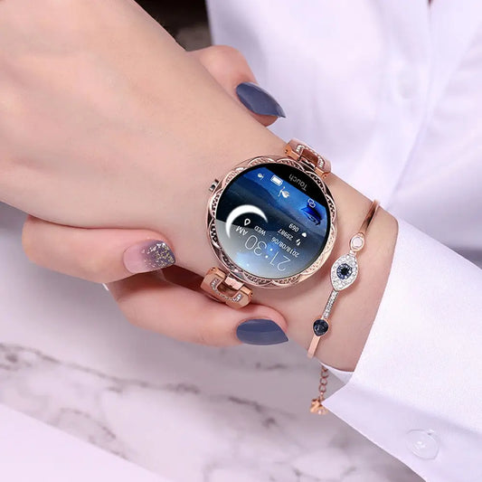 Rose gold smartwatch with decorative bezel.