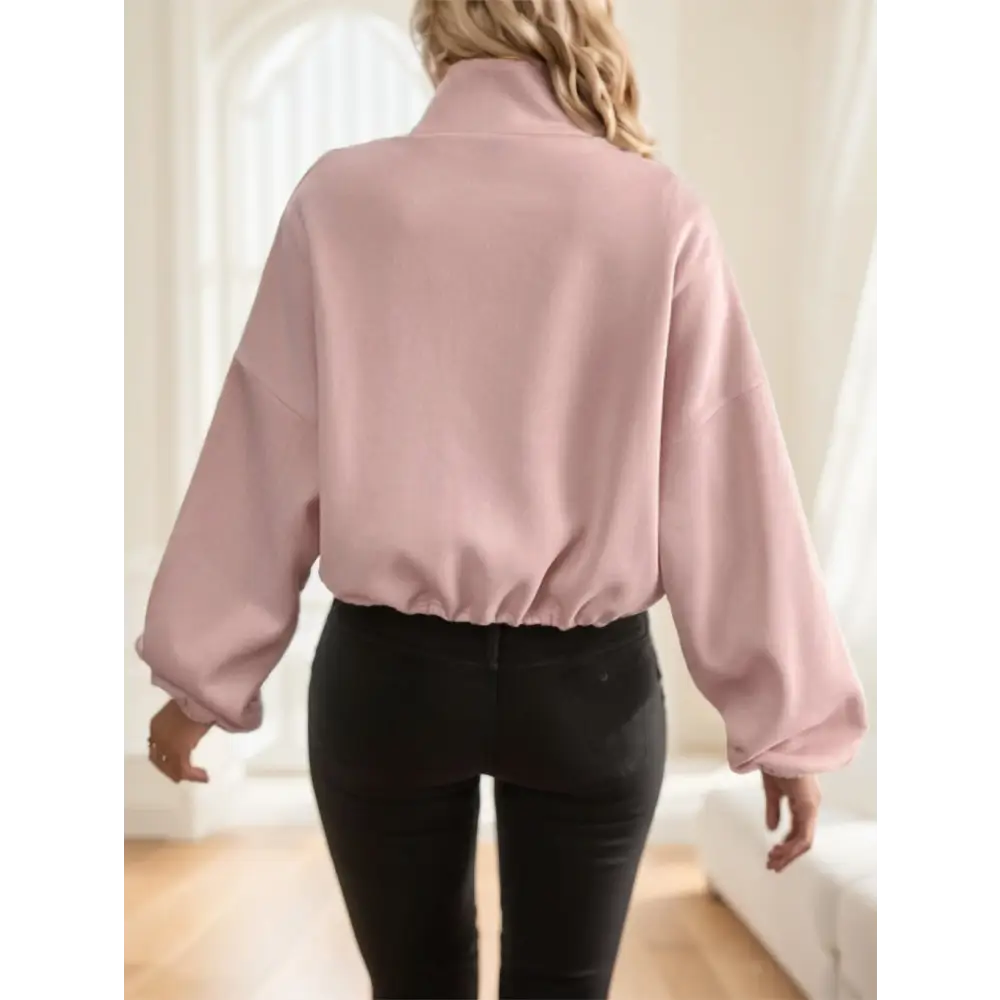 Pink cropped sweatshirt.