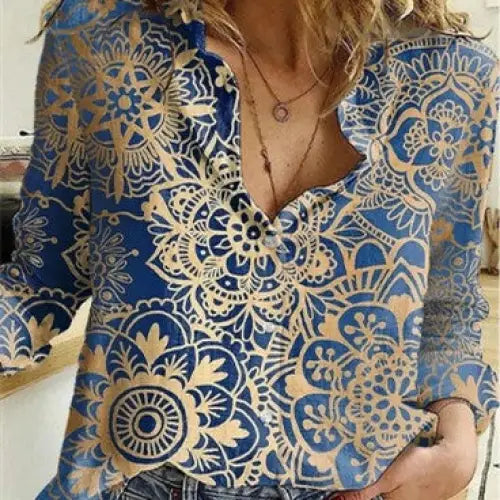 Blue and gold patterned blouse.