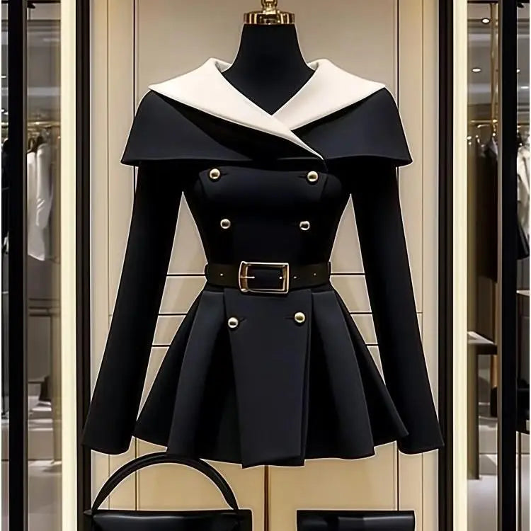 Black belted jacket with white collar.