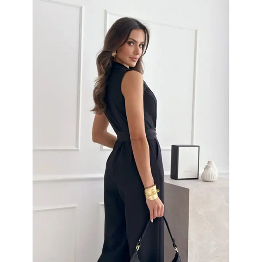Sleeveless black jumpsuit with belt.
