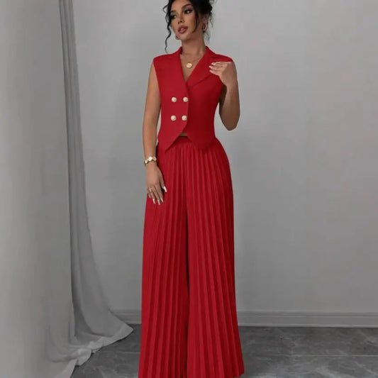 Red sleeveless blazer and pleated pants set.