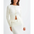 Cream-colored ribbed knit cardigan and skirt set.