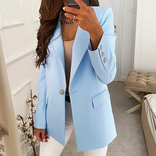 Light blue blazer with silver buttons.