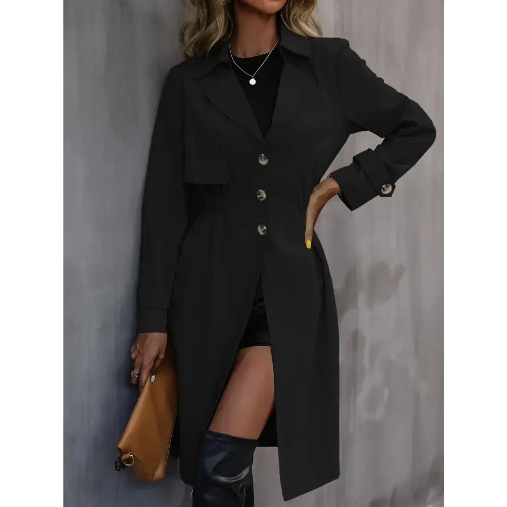 Black trench coat with thigh-high boots.