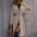 Beige trench coat.
