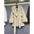 Cream-colored faux fur coat with a tie waist.