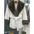 White faux fur coat with brown trim.