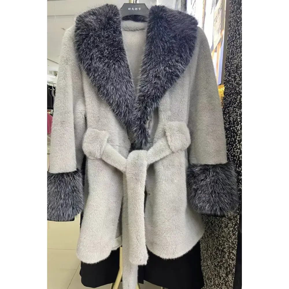Gray faux fur coat with dark gray trim.