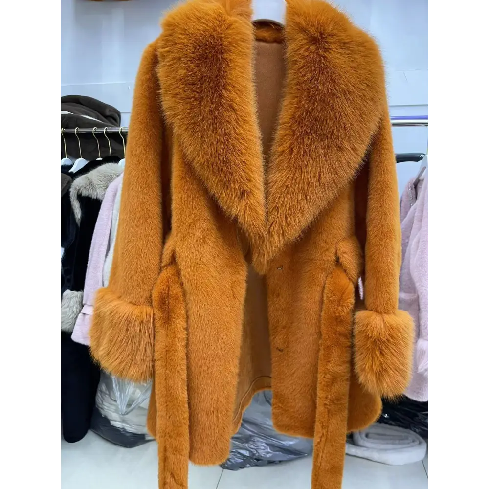 Orange faux fur coat with a large collar and cuffs.