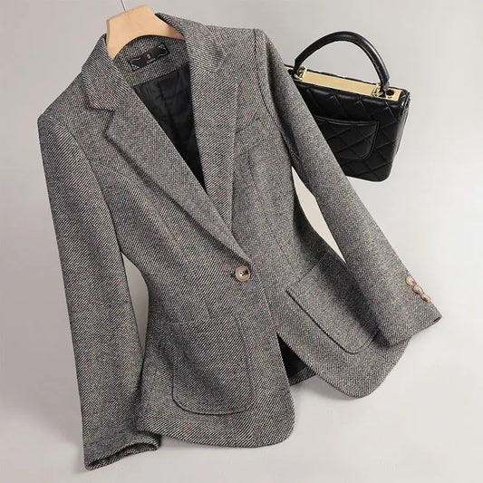 Gray herringbone blazer.
