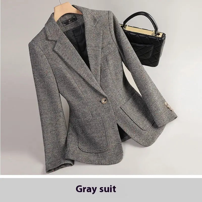Gray herringbone blazer.