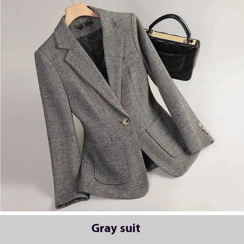 Gray herringbone blazer.